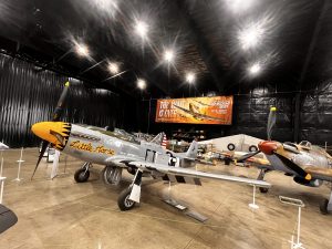 WWII aircraft displayed inside the Flying Legends Hangar at Dakota Territory Air Museum.